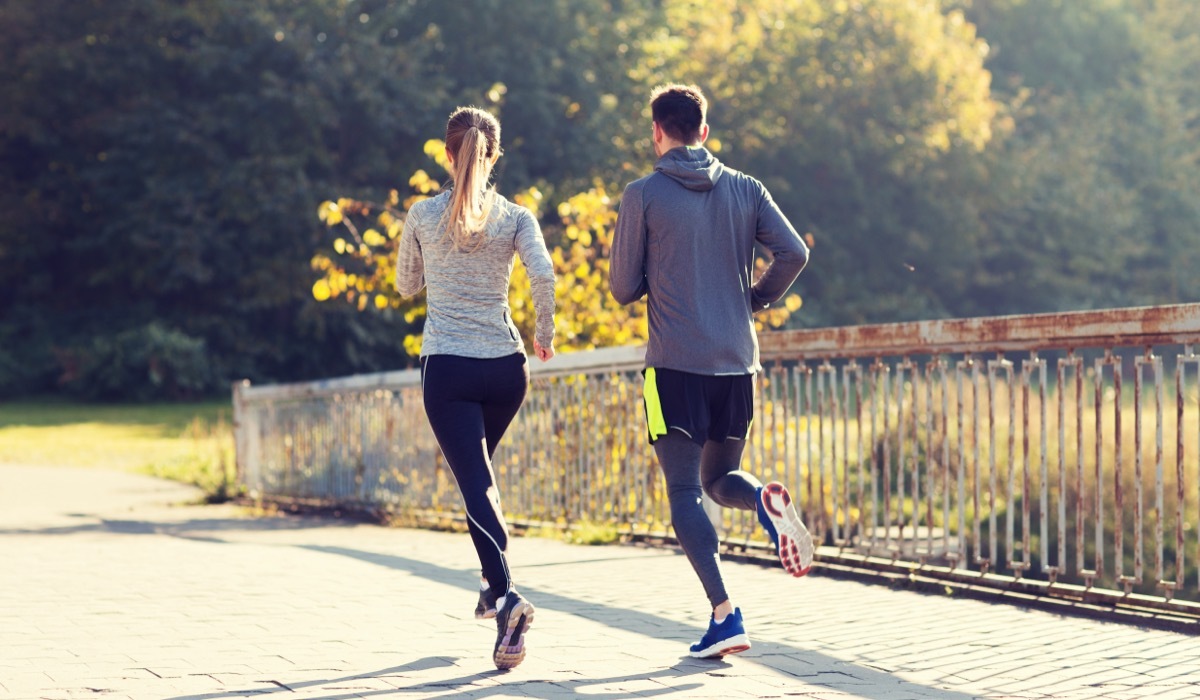 A couple running. Regular exercise helps reduce stress at work.