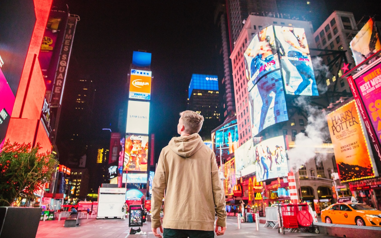 A man looking at ads in a junction