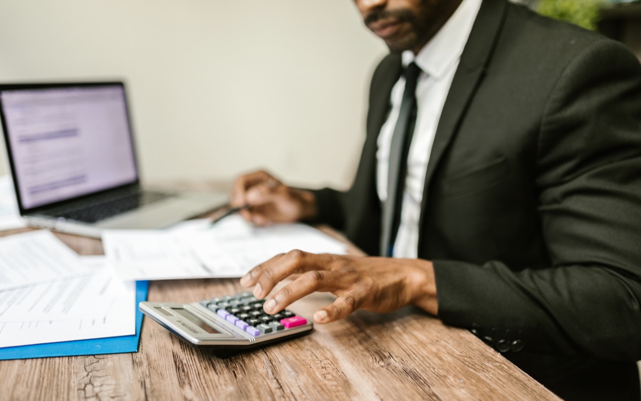 A man checking a bank statement of a business