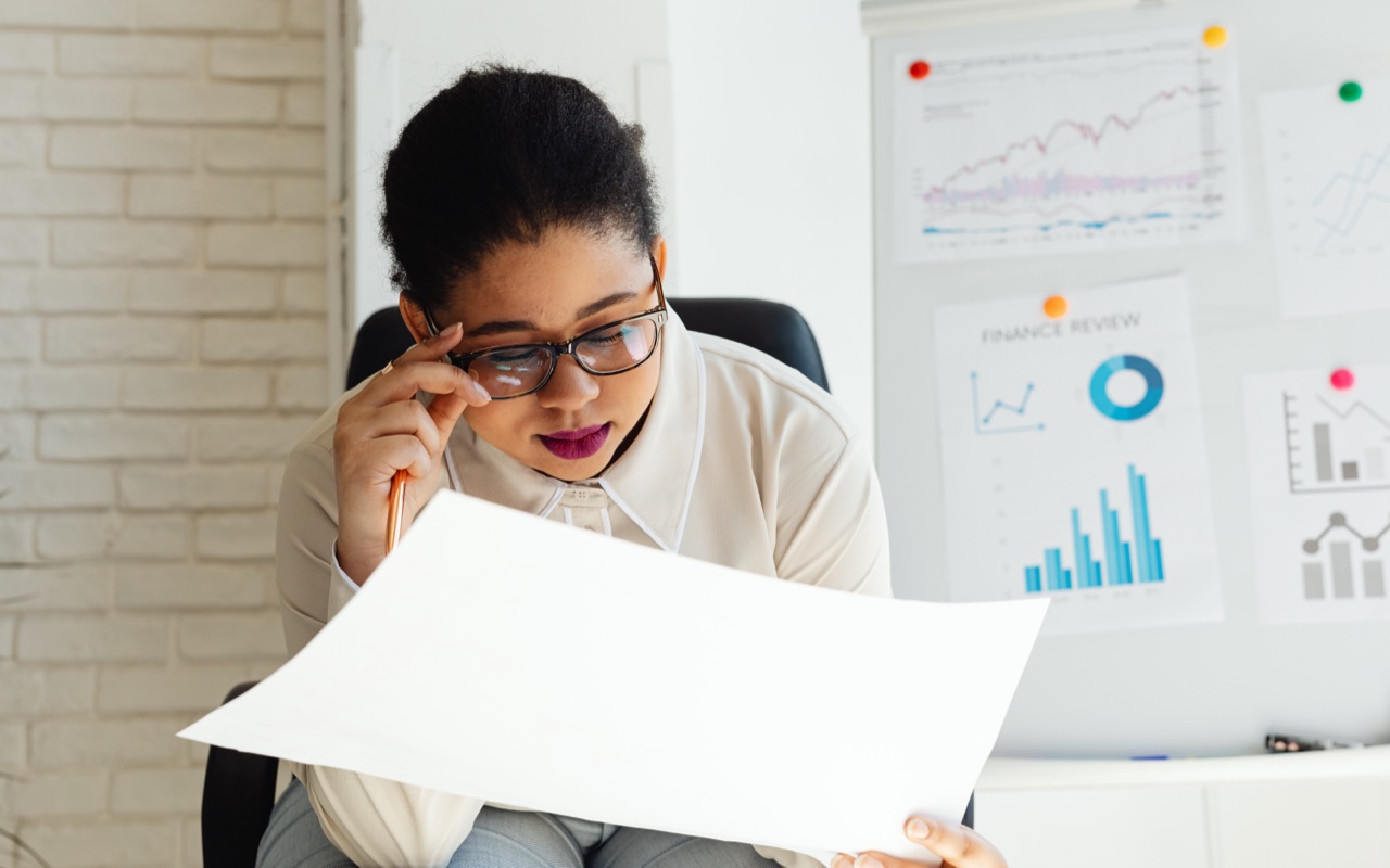 A woman reviewing an accounts statement