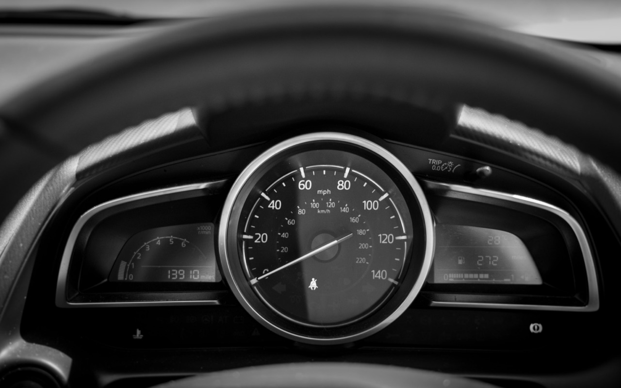 Car dashboard showing speedometer