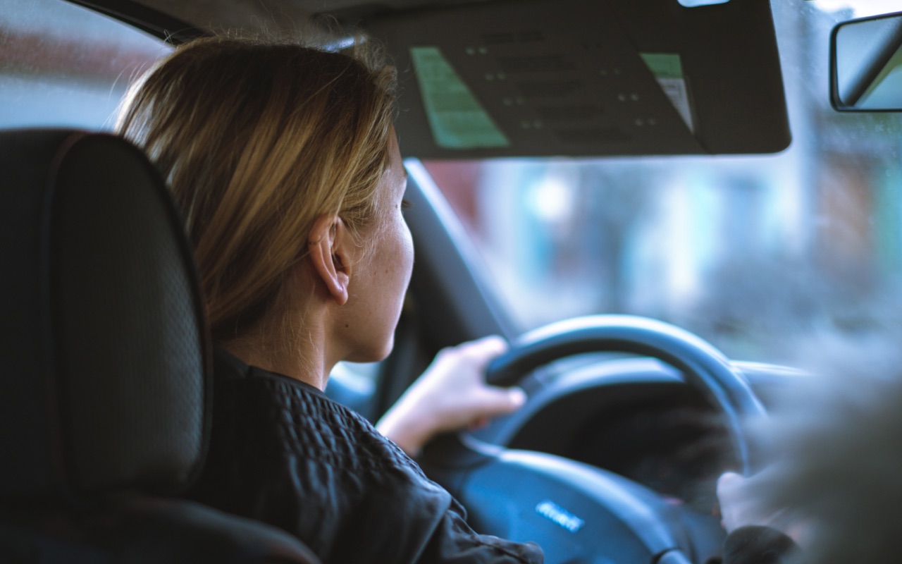 A woman driving a car