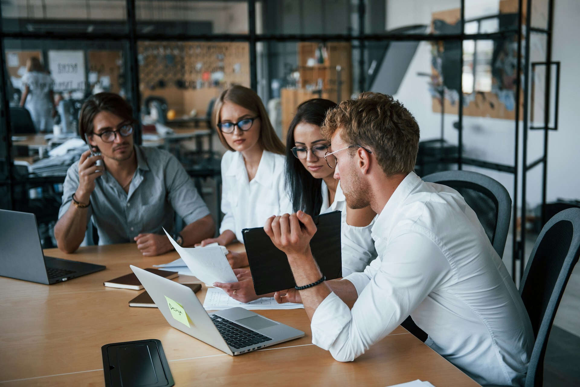 A business meeting with four people