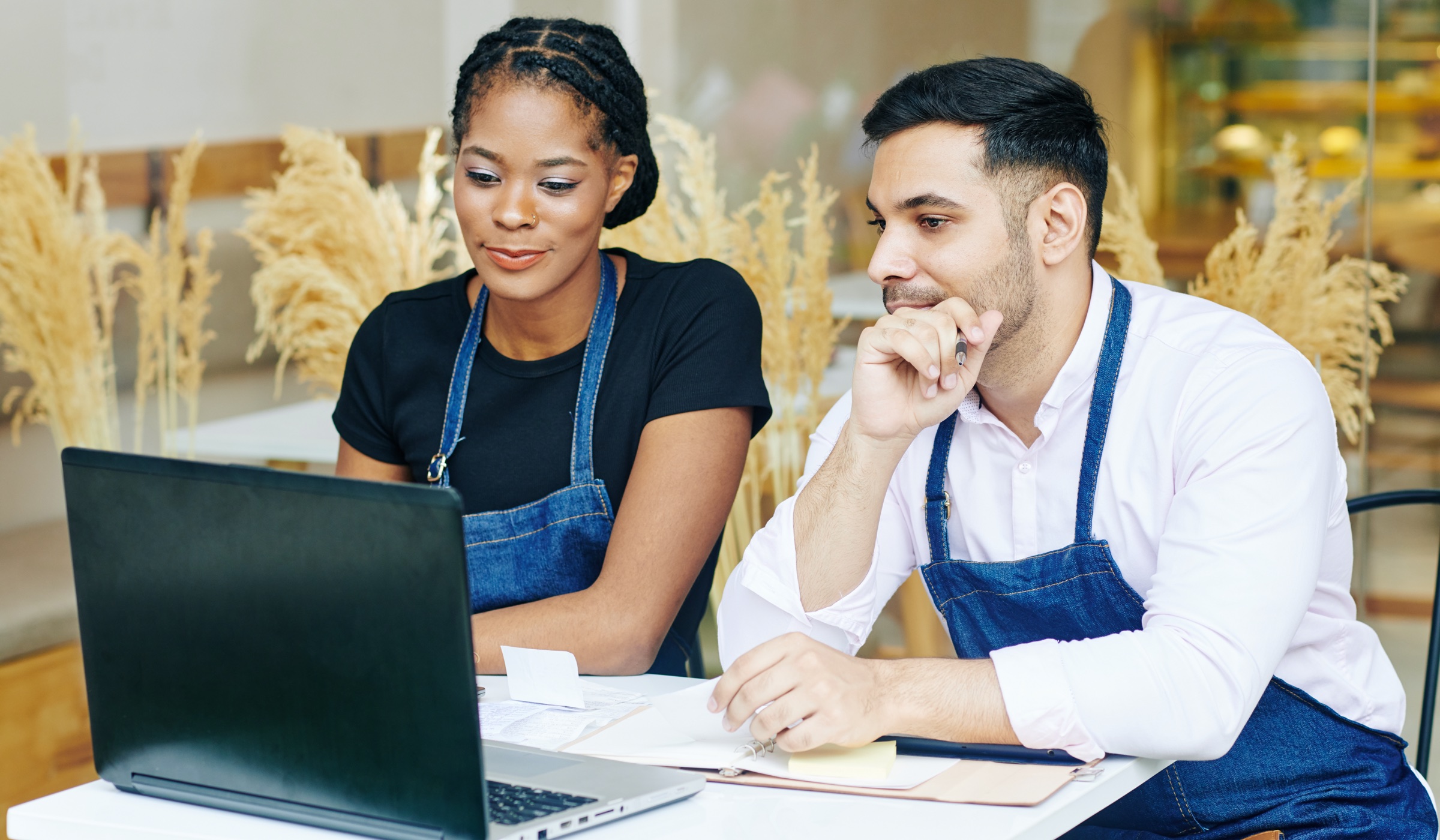 Couple checking invoice email